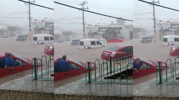Hombre escapa por la ventana de su auto, en creciente de agua por lluvias en Culiacán (VIDEO)