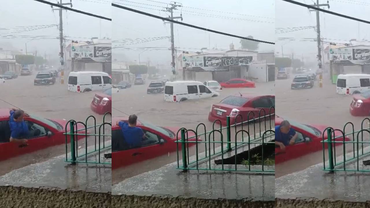 Hombre sale de su carro por la ventana tras lluvias en Culiacán