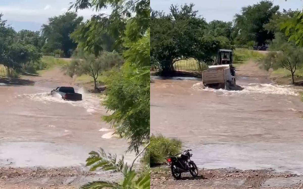 vehículos cruzando arroyo crecido