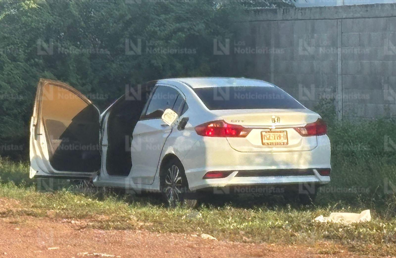 Hallan cuerpo semicalcinado en vehículo en Culiacán